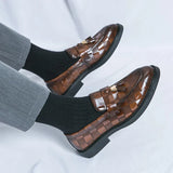 Mocassini uomo con nappine in vernice lucida